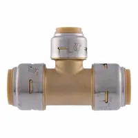 This brass push-to-connect reducer tee connects three tubes of different diameters, branching a 3/4 in OD line to a 1/2 in OD line while maintaining a straight 3/4 in OD run. It is used in plumbing systems for water supply distribution, allowing tool-free installation on copper, PEX, CPVC, or PE-RT tubing