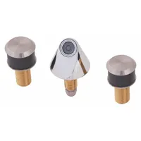 This widespread brass faucet in chrome finish is operated by a manual button and powered by a 9V DC plug-in source. It is designed for use with a single tempered water supply line, suitable for institutional settings such as commercial restrooms and public washrooms