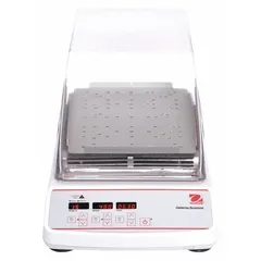 OHAUS Incubating Shaker with a speed range of 100 RPM to 1,200 RPM. Features a Caution Hot Indicator. Includes a standard plug. Used in laboratories for mixing and incubating samples simultaneously, suitable for applications requiring controlled agitation and temperature.