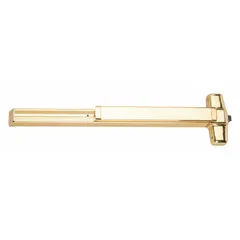 Rim-type exit device with touchbar style, suitable for doors up to 3 ft wide. Constructed with a brass finish and equipped with a night latch outside trim. Complies with ADA requirements for accessible egress. Commonly used in commercial buildings where code-compliant panic hardware is needed.