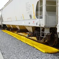 This railroad track berm provides secondary containment for capturing leaks and drips under outrigger pads on rail tracks. Constructed from PVC, it measures 20 ft x 30 in x 4 in with a 124-gallon spill capacity. Its low-profile design fits under equipment without obstructing operations