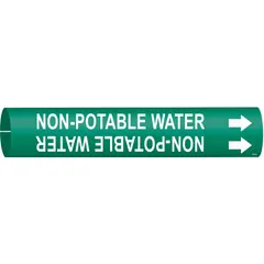 Green snap-on pipe marker with white legend reading 'Non-Potable Water' and directional arrows. Fits pipe outer diameters from 1-1/2 to 2-3/8 inches. Used to identify non-potable water lines in piping systems, helping to prevent cross-connections with drinking water supplies.