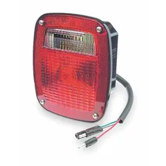 Incandescent stop, turn, and tail combination light with clear/red square lens. Features stud mount, pigtail electrical connection, and permanent installation. Complies with FMVSS 108 standards. Suitable for use on trucks, trailers, and heavy equipment requiring a red/clear combination light.