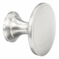 This satin nickel-finished cabinet knob is made of zinc and features a round grip shape with a 1 3/4 in grip diameter. It includes all necessary mounting hardware for installation. Suitable for use on cabinet doors and drawers in various settings such as kitchens, workshops, and facility cabinetry