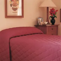 This quilted bedspread from MARTEX is made of a cotton/polyester blend fabric with polyester fiberfill. It features a solid Chianti color and a quilted stitching pattern. Suitable for use as a decorative cover or lightweight layer on twin-sized mattresses in residential or hospitality settings
