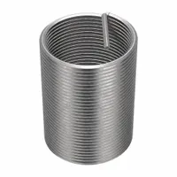 Free-running tanged helical insert made from 18-8 stainless steel. Thread size 1 3/8"-6, right-hand orientation. Used to repair or reinforce tapped threads in metal components such as engine blocks, industrial machinery, and hydraulic systems