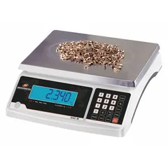 Compact bench scale for weighing parcels and packages in shipping and logistics. Features 6 lb capacity, 0.1 g / 0.0002 lb readability, stainless steel construction, and 8 3/4 in weighing surface depth. Supports g, kg, lb, oz units. Includes RS-232 interface for data connectivity.