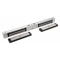This DYNALOCK double-door magnetic lock is constructed with an aluminum housing and features instantaneous release. It is designed for securing paired access points in commercial or industrial settings where fail-safe locking and integration with access control systems are required