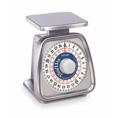 Mechanical dial scale for weighing food ingredients in commercial kitchens, bakeries, and food service operations. Features a 5 1/4 in wide by 6 in deep weighing surface and 7 1/4 in overall height. Suitable for portion control and recipe preparation with standard food containers.
