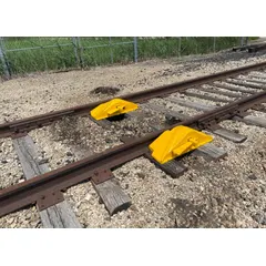 This rerailer is used to guide derailed freight car wheels back onto the rail. Its outside rail design supports rerailing operations in industrial rail yards, maintenance facilities, and freight rail networks.