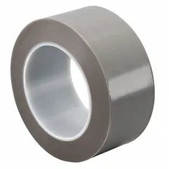 This PTFE slick surface tape features a gray polytetrafluoroethylene film backing with a silicone adhesive. It provides a low-friction, non-stick surface for industrial applications such as chute liners, guide rails, and packaging machinery to reduce material buildup and improve product flow.