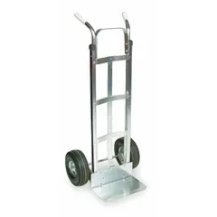 This hand truck features a silver aluminum frame for corrosion resistance and pneumatic tires for cushioning over uneven surfaces. The dual-pin handle adjusts for load balance. Suitable for moving loads in industrial, warehouse, and commercial settings.