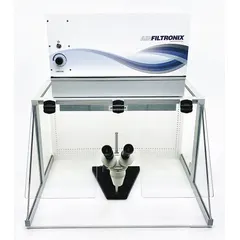 This light duty ductless fume hood is fully assembled and includes a blower, base/stand, and work surface. It is designed for use with microscopes, featuring a cut-out to accommodate the eyepiece while providing operator protection during sample preparation and staining. The white unit measures 30 inches wide by 35 inches high.