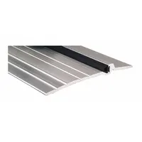 This 3 ft long saddle threshold is made of aluminum alloy with a fluted transition surface. It is installed at doorways to bridge gaps between flooring materials and accommodate wheeled traffic in commercial and industrial settings
