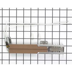 This range ignitor generates a spark to ignite burner gas in gas ranges and cooktops. It is used as a replacement component during service repairs for residential cooking appliances.