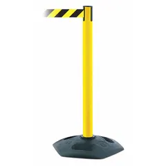 This retractable belt post barrier features a yellow plastic post with a rubber base and a 13 ft black/yellow belt with chevron pattern and no printed legend. Used for managing pedestrian flow and cordoning off areas in industrial, commercial, and public environments.