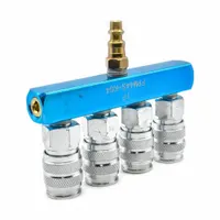 This rectangular aluminum manifold distributes pneumatic or fluid lines from a single source to four outlets. It is used in industrial air and fluid block systems for efficient routing and distribution