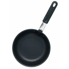 This 12 1/2-inch non-stick fry pan features a black aluminum body with a gray riveted steel handle. NSF certified for commercial use, it is suitable for high-volume food preparation in institutional kitchens. The non-stick coating facilitates easy cleaning and food release.