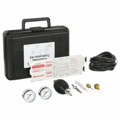 This black accessory is a repair and calibration tool for pneumatic thermostats. It includes an In-Line Gage Tee for connecting pressure gauges during service. Used by HVAC technicians to maintain and calibrate pneumatic control systems in commercial buildings.