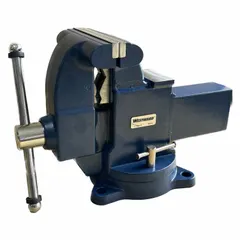 This bench vise features an enclosed design with serrated steel jaws. The 8-inch jaw face width and 8 3/4-inch maximum opening accommodate a range of workpieces. It is mounted via bolt-down for secure attachment to workbenches. Typical applications include clamping parts during machining, assembly, or repair tasks in industrial settings.
