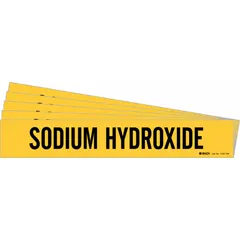Yellow adhesive pipe marker with black legend text reading 'Sodium Hydroxide'. Fits pipe outer diameters of 8 inches and larger. Pack of 5 markers without arrows. Used to identify pipes carrying sodium hydroxide in industrial piping systems.