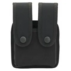 This duty equipment pouch is constructed from black nylon and measures 2 inches by 6 inches. It features a snap closure and is designed to fit belts up to 2 1/4 inches wide. Commonly used for carrying spare magazines in law enforcement, security, or tactical applications.