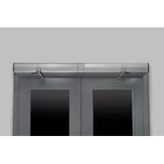 This NORTON 6000 Series low energy door operator is a heavy-duty, aluminum-painted unit for interior/exterior limited-traffic applications. It measures 36 inches in length, 4 3/4 inches in width, and 5 3/16 inches in height. The operator is ADA compliant, electrically powered, and non-hold-open, suitable for automatic door control in facilities requiring reliable access without full-power automation.