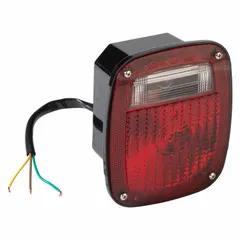 Rectangular red incandescent combination light providing stop, turn, and tail functions. Bracket mount for permanent installation with pigtail electrical connection. Complies with FMVSS 108 standards. Suitable for use on trucks, trailers, and heavy equipment requiring a red rear lighting function.