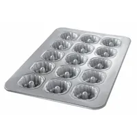 This 15-slot mini bundt cake pan is made of aluminized steel with a glazed silver finish. It features a solid construction with closed bead closure and measures 17 7/8 inches in overall width. Suitable for baking individual bundt cakes in commercial or high-volume kitchen settings
