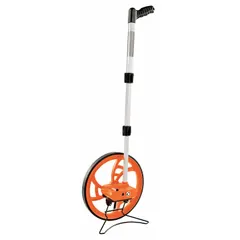 This mechanical measuring wheel features a fixed handle with pistol grip, a spoked single wheel with rubber tread, and an ABS plastic frame. It measures distances up to 9,999 m in metric units and requires no batteries. Suitable for outdoor tasks such as estimating material quantities or marking boundaries on uneven terrain.