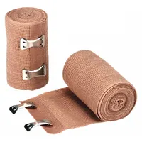 Non-sterile elastic fabric bandage wrap, 3 inches wide by 5 yards long, self-adhering and latex-free. Beige color, not water resistant, includes clips for secure fastening. Meets ANSI/ISEA Z308.1-2015 standards. Used to secure dressings, provide compression, and support sprains or strains