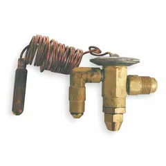 Angle-configured thermostatic expansion valve for R-134A refrigerant with 1 ton nominal capacity. Features field-adjustable superheat and removable strainer. Includes sensing bulb mounting clamp. Used in refrigeration and HVAC systems to regulate refrigerant flow into the evaporator.