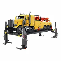 This electric/hydraulic forked mobile column lift has a 14 ton load capacity and a steel frame. It is operated via a wireless lifting actuator, enabling portable lifting without fixed installation. Typical applications include lifting heavy vehicles such as trucks and buses in automotive repair and fleet maintenance settings
