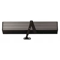 Heavy-duty, non-hold open door operator for limited-traffic interior/exterior applications. Measures 20 in Lg x 3 5/8 in Wd x 3 3/4 in Ht with dark bronze painted finish. Performance Grade 1 and ADA compliant. Suitable for commercial entrances requiring controlled closing without hold-open