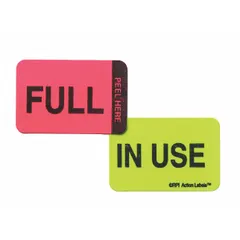 Paper safety label measuring 1 1/2 in wide by 1 in high, rectangular shape, green/pink color with English text. Used for hazard communication and identification on equipment, pipes, or areas in industrial environments.