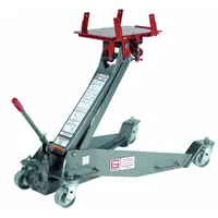 This hydraulic transmission jack has a 1.1 ton load capacity and a steel frame. It is operated by a manual handle and secures loads with a nylon strap. Typical applications include removing and installing transmissions in automotive and industrial repair shops