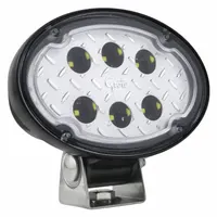 LED oval spotlight with Deutsch DT electrical connection. Overall diameter 5 15/16 inches, overall depth 2 3/4 inches. Suitable for vehicle applications requiring a compact, focused close-range lighting solution