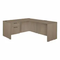 Double pedestal desk with particle board desktop and frame in Oak and Noble Oak finish. Includes one pedestal with two drawers and a modesty panel. Overall width 66 inches, height 29 inches. Suitable for office or administrative workstations