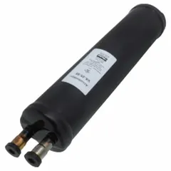 Steel shell suction line accumulator with copper sweat connections and a metering orifice. Designed to protect compressors by temporarily storing excess liquid refrigerant and oil during system cycling, then metering them back at a safe rate. Suitable for use in refrigeration and air conditioning systems.