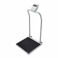Column-mounted handrail scale with a 20 1/2 in by 18 in weighing surface. Provides weight readings in kg or lb. Suitable for weighing individuals who require support, such as in medical or assisted-living environments