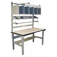 Laminate-top packing table with gray finish, adjustable height from 30 to 36 inches. Includes a corrugated storage shelf with four 12 x 18 inch dividers and a shop light. Suitable for packing, assembly, and inspection tasks in industrial environments.
