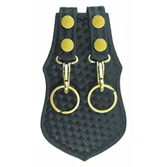 Black leather key pouch with basket weave texture. Snap closure secures keys to belts up to 2 1/4 inches wide. Measures 5 inches by 115 mm. Suitable for carrying keys in industrial or facility settings.