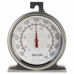 Analog oven thermometer with a 2-inch dial and 1 11/16-inch overall length. Features a stainless steel case, glass lens, and hanger. Accuracy of ±5 °F. NSF certified and metal detectable for use in food safety environments.