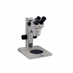 Trinocular stereo microscope with 0.7X to 3X zoom range and 20 mm optical field of view. Standard stand with 10 in x 10 in base. Suitable for inspection, assembly, and quality control tasks requiring detailed observation of small components.