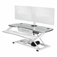 Electronic standing desk converter with a white wood desktop, 40-inch width and 24-inch depth. Allows users to alternate between sitting and standing positions. Suitable for office workstations, control rooms, and technical environments requiring ergonomic flexibility