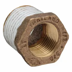 Threaded low-pressure pipe fitting for potable water systems. This brass reducer connects 1/2 in to 3/8 in pipes with PTFE thread sealant applied. Rated Class 125 with a maximum operating pressure of 200 psi.