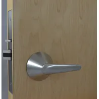 This passage lever lockset is designed for interior doors where locking is not required. Constructed with a satin stainless steel finish, it is ADA compliant and ligature-resistant, suitable for behavioral health, correctional, and institutional settings. The LSL lever style provides easy operation without a visual indicator