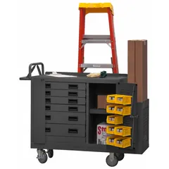 This fully assembled steel mobile cabinet bench in gray provides a 1,200 lb overall load capacity. It includes louvered panels, drawers, and shelves for organized storage, plus a handle on the side for mobility. Suitable for assembly, maintenance, and repair tasks in industrial settings.