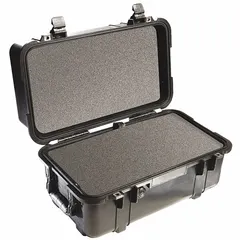 The PELICAN 1460 is a suitcase-style protective case with interior dimensions of 9 7/8 in x 18 1/2 in x 10 7/8 in. It features a double-throw closure and includes a convoluted, pick and pluck, and solid foam interior for customizable cushioning. This case is not carry-on size and is suited for transporting sensitive equipment such as cameras, electronics, or tools.