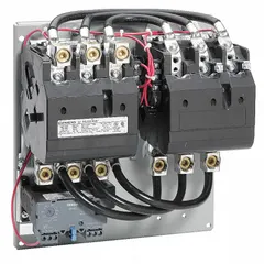 Three-phase reversing motor starter, NEMA Size 4, rated 135 A. Features electronic overload protection (no thermal units required), 110/120V AC coil, screw terminals, pilot light, and one normally open auxiliary contact. Used for forward/reverse control of three-phase motors in applications such as conveyors, pumps, and hoists.